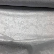 Tissu en coton enduit argent brodé