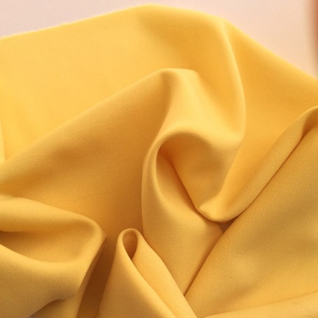 Tissu de laine crêpe envers satin jaune pour pantalon, jupe, robe droite